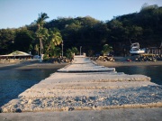 sloppy slabbing, wobbly wharfing, precarious piering, DIY docking, messy muelle con toca de tico, Playa Flamingo, Costa Rica