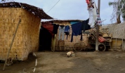 A sad pup lies tethered to a pole in the yard of his desert slum house. You would never guess that on the inside of that house is a comfy living room with flat screen TV, surround sound system and glass cabinets of fake fine china. Huarmey
